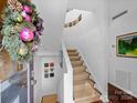 Entryway with staircase, holiday decor, and artwork at 1401 Scotland Ave, Charlotte, NC 28207