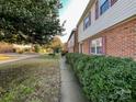 Side view of townhome showing walkway and landscaping at 8915 Hunter Ridge Dr, Charlotte, NC 28226