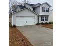 New construction two-story home with white garage door and concrete driveway at 1309 Dodd St, Shelby, NC 28152