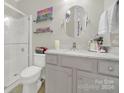 Bathroom features a walk-in shower, gray vanity, and marble countertop at 15175 Legend Oaks Ct, Fort Mill, SC 29707