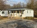 Quaint single-story home with a covered porch and a porch swing at 515 37Th Sw St, Hickory, NC 28602