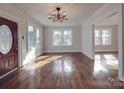 Sunlit living room with hardwood floors and a view into other rooms at 616 Highland Ave, Statesville, NC 28677