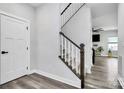 Modern staircase with dark wood and white railings at 1051 Barnette Farm Ln, Monroe, NC 28110