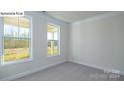 Bright, spacious bedroom with large windows and neutral carpeting at 2035 Skyhawk Dr, York, SC 29745