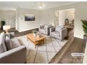 Inviting living room with plush seating, a coffee table, and stylish decor at 10907 Magenta Ln, Charlotte, NC 28262