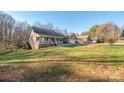 House exterior showcasing landscaping and a driveway at 1350 Kensington Cir, Newton, NC 28658