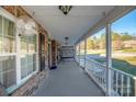 Covered porch with swing and white railings at 1350 Kensington Cir, Newton, NC 28658