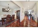 Spacious dining room with hardwood floors and a view into the living room at 29162 Pennington Rd, Albemarle, NC 28001