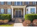 Impressive entrance with double doors and brick columns at 5225 Firebrick Sw Ln, Concord, NC 28025