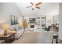 Spacious living room featuring a fireplace and access to a deck at 13831 Walkers Creek Dr, Charlotte, NC 28273