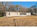 Tan ranch home with screened porch and detached garage at 1295 Reservation Rd, Rock Hill, SC 29730