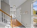 Bright foyer with hardwood floors and a view into the adjacent dining area at 183 Bellelaine Dr, Mooresville, NC 28115