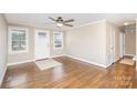 Bright living room with hardwood floors, a ceiling fan, and access to other rooms at 303 Villa St, Kannapolis, NC 28083