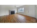 Living room with hardwood floors and fireplace at 3147 Dawnshire Ave, Charlotte, NC 28216