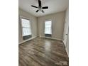 Bright bedroom with ceiling fan and wood-look flooring at 5 Cauthen St, Rock Hill, SC 29730