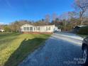 Ranch home with sunroom and gravel driveway at 126 Beechwood Dr, Salisbury, NC 28147