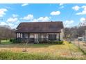 Charming house with a screened-in front porch and fenced yard at 45 Sunderland Rd, Concord, NC 28027