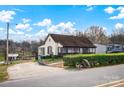 Front view of a one-story home with screened porch and landscaping at 45 Sunderland Rd, Concord, NC 28027
