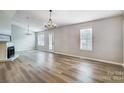 Living room with fireplace and hardwood floors at 602 Helms Dr, Lowell, NC 28098