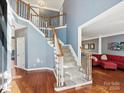 Elegant two-story foyer with hardwood floors and a staircase at 116 Lockerbie Ln, Mooresville, NC 28115