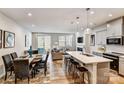 Open floorplan with kitchen, dining area, and living room seamlessly connected at 2735 Texana Ct, Charlotte, NC 28269