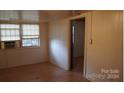 Basic bedroom with wood floors and window at 111 River Ridge Trl, Mount Gilead, NC 27306