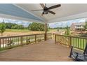 Spacious covered back porch with a ceiling fan at 4692 Hopsack Dr # Cal0103, Indian Trail, NC 28079