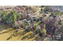 Bird's-eye view of lakefront property with a house and dock at 60 Sigmon Drum Rd, Hickory, NC 28601