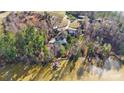High-angle view showcasing a lakefront home and its surroundings at 60 Sigmon Drum Rd, Hickory, NC 28601