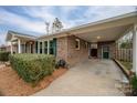Covered carport with attached storage room and brick exterior at 753 Schuyler Dr, Rock Hill, SC 29730