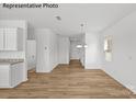 Spacious dining area with hardwood floors and lots of natural light at 10003 Travis Floyd Ln # 050, Charlotte, NC 28214