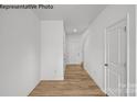 Bright and airy entry hall with light wood flooring at 10003 Travis Floyd Ln # 050, Charlotte, NC 28214