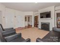 Spacious living room with fireplace and ample natural light at 16718 Dolcetto Way, Charlotte, NC 28277