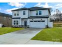 Two-story house with white siding, gray roof, and stone accents at 3050 Swallowtail Ln, Kannapolis, NC 28083