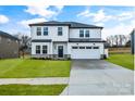 Two-story house with white siding, gray roof, and stone accents at 3050 Swallowtail Ln, Kannapolis, NC 28083
