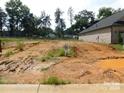 Empty lot, mostly dirt and some weeds at 415 Newstyle Way # 6, Cramerton, NC 28056