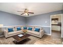 Virtually staged living room with comfortable seating and a coffee table at 124 Redwood Ln, Gastonia, NC 28052