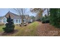 Landscaped yard with pathway beside charming homes in community at 132 Lone Oak Cir, Rock Hill, SC 29732