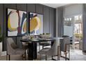 Elegant dining room with dark wood table and access to patio at 3030 Hutton Gardens Ln, Charlotte, NC 28269