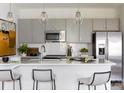 Modern kitchen with gray cabinets, white countertops, and island at 3030 Hutton Gardens Ln, Charlotte, NC 28269