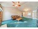 Bright living room featuring a vaulted ceiling and neutral color palette at 1607 English Knoll Dr, Matthews, NC 28105