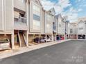 Condo building with multiple units and covered parking spaces at 509 N Graham St # 1G, Charlotte, NC 28202