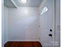 Bright entryway with hardwood floors and a white door at 7800 Highbanks Ct, Charlotte, NC 28212