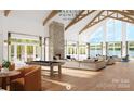 Bright community room with high ceilings, fireplace, and lake view at 4941 Marina Dr # 199, Sherrills Ford, NC 28673