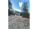 One-story house with gray siding and stone accents on a large lot at 6767 Nathan Ave, Kannapolis, NC 28081