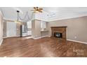 Living room with hardwood floors, brick fireplace and kitchen at 3100 Nc Hwy 18 Hwy, Vale, NC 28168