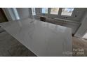 Large kitchen island with stunning quartz countertops at 400 Belton Ave, Mount Holly, NC 28120