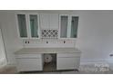 Modern kitchen with white shaker cabinets and quartz countertops at 400 Belton Ave, Mount Holly, NC 28120