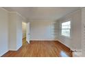 Spacious bedroom with hardwood floors and built-in shelving at 531 N Carolina Ave, Statesville, NC 28677