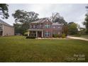 Brick two-story house with landscaping and a red door at 1735 Herndon Farm Rd, Rock Hill, SC 29732